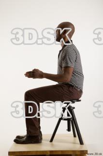 Sitting reference of whole body black white striped shirt brown…